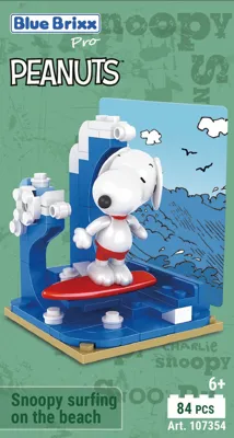 Peanuts™ Snoopy surfing on the beach